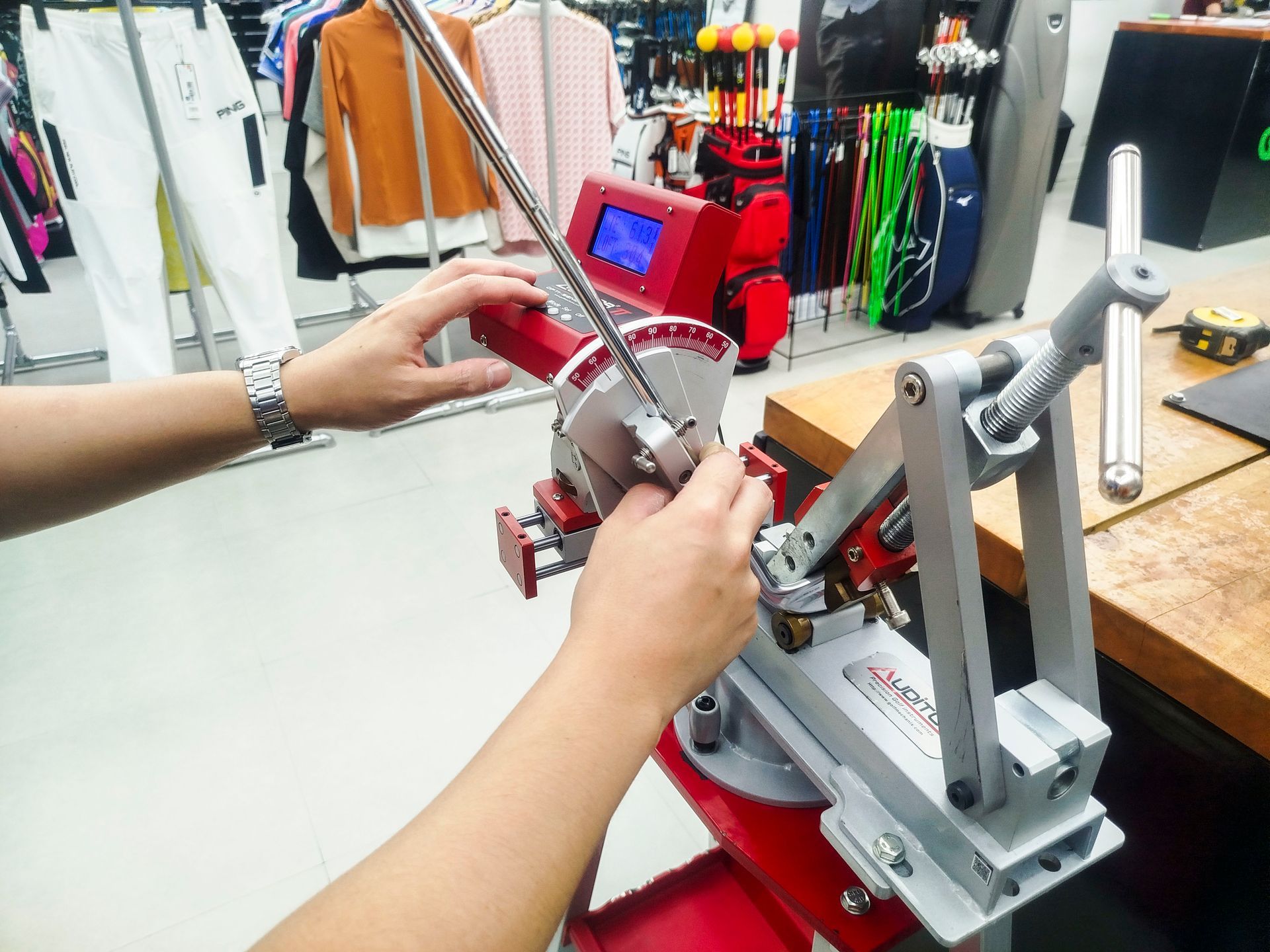A person is working on a machine in a store.