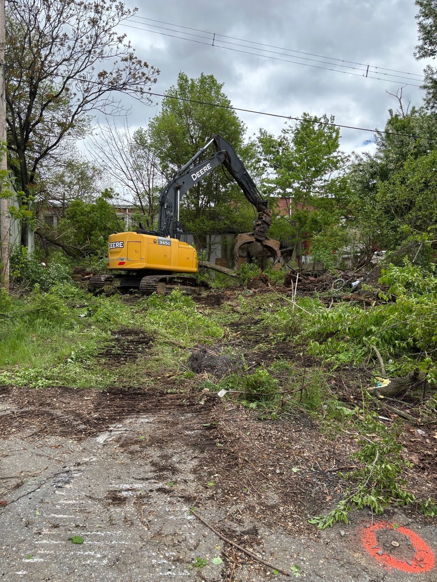 Empire Services crew grubs the back of the property.