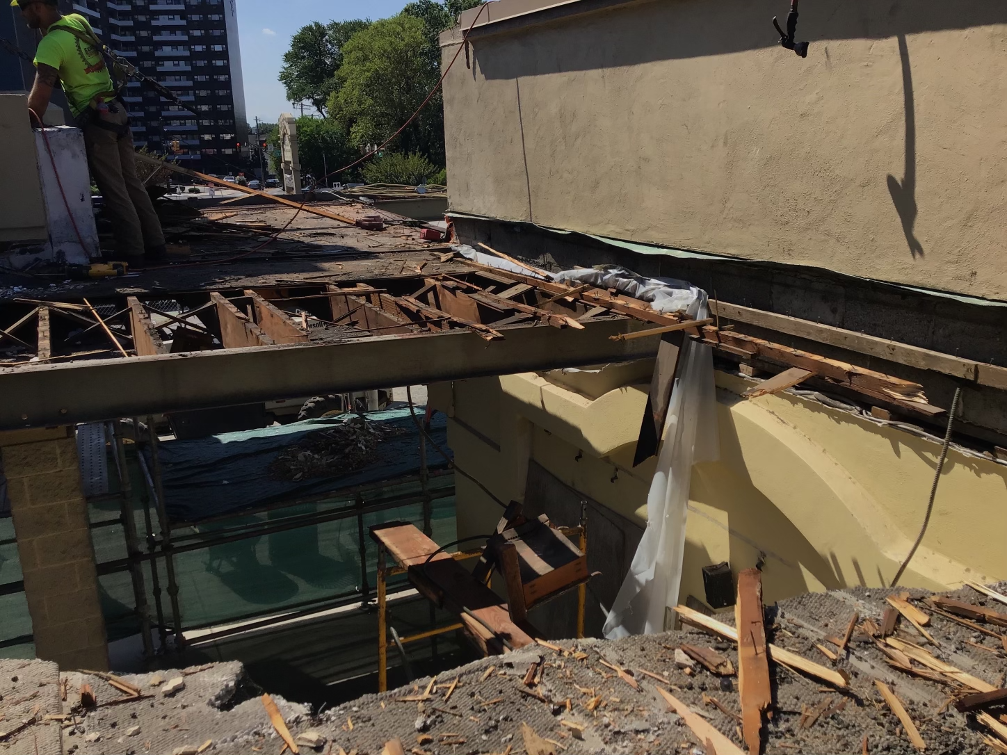 A building is being demolished with a lot of rubble on the ground