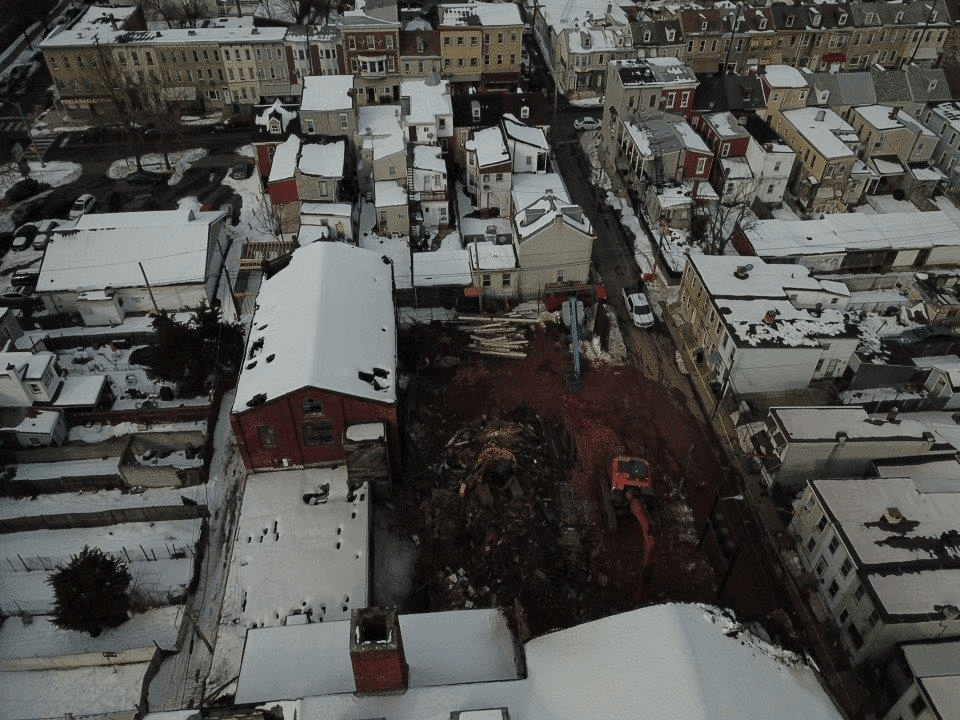 An aerial view of a city covered in snow