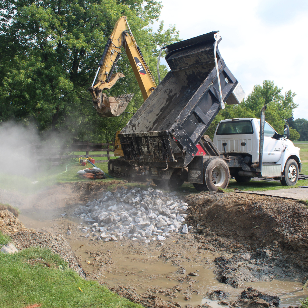 Delivering stones for the culvert.