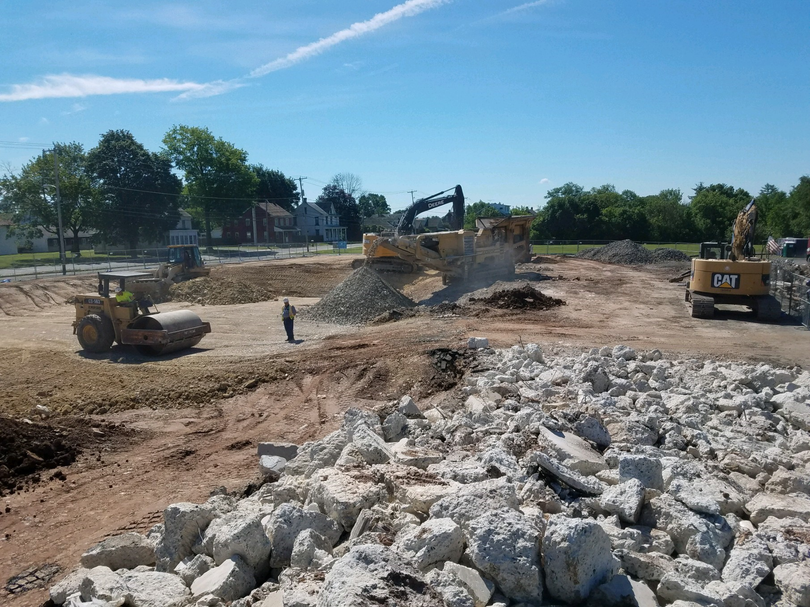 A construction site with a lot of rocks and machinery.