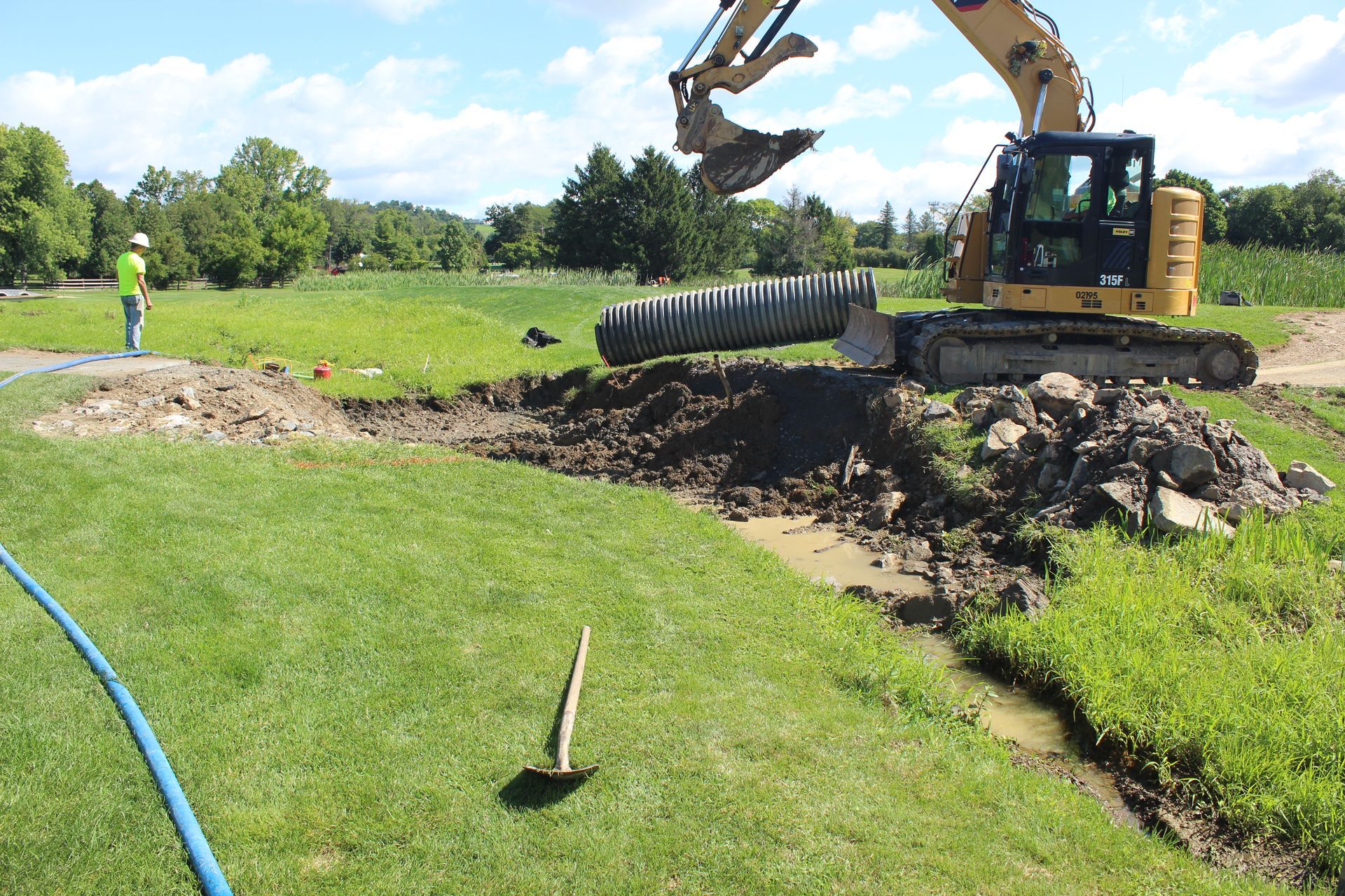 The old plastic pipe was removed and preparing for the new concrete pipes. 