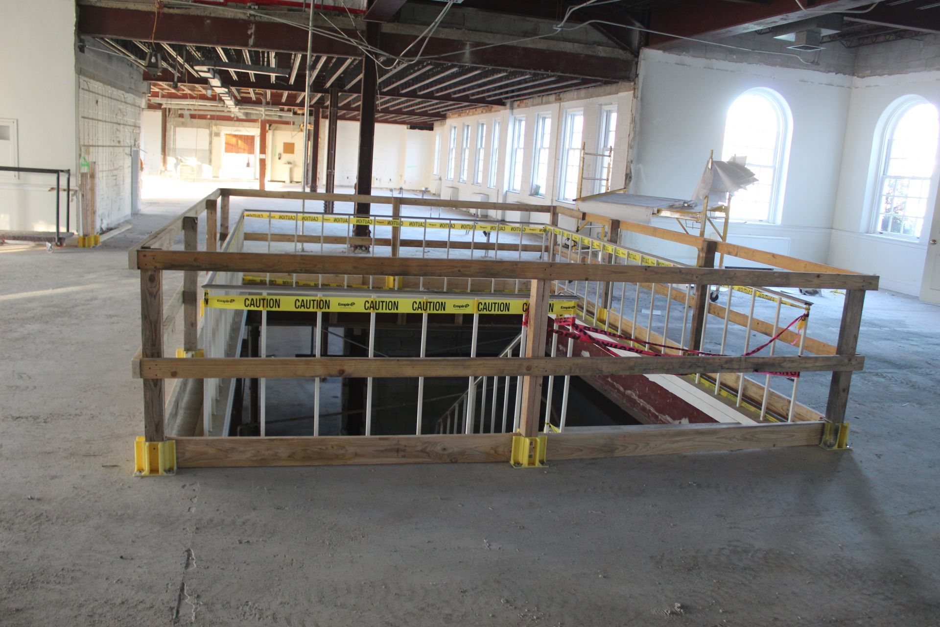 Safety first! Wood blocks the grand staircase before the back wall is removed. 