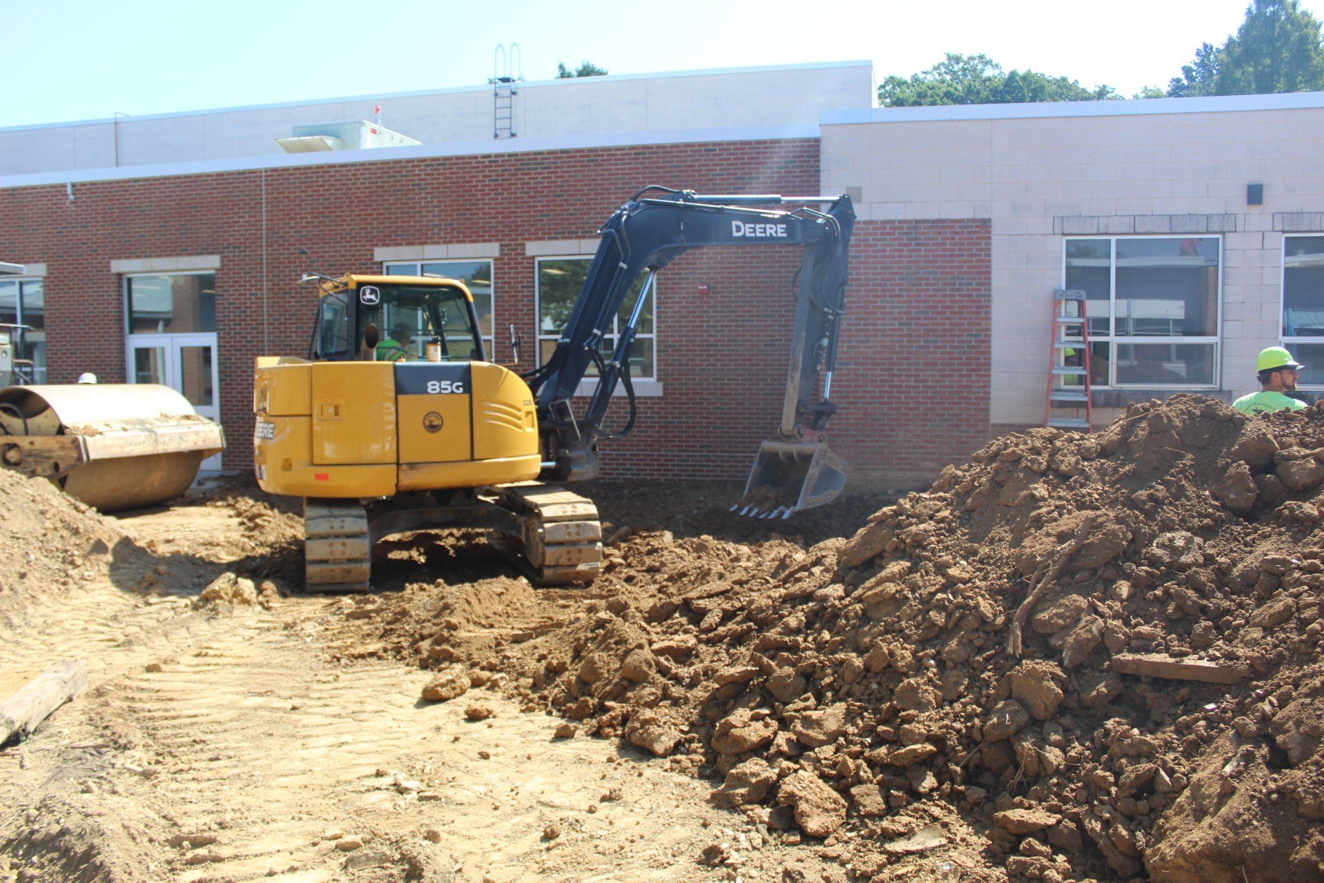Making progress land grading for new playground at an elementary school. 