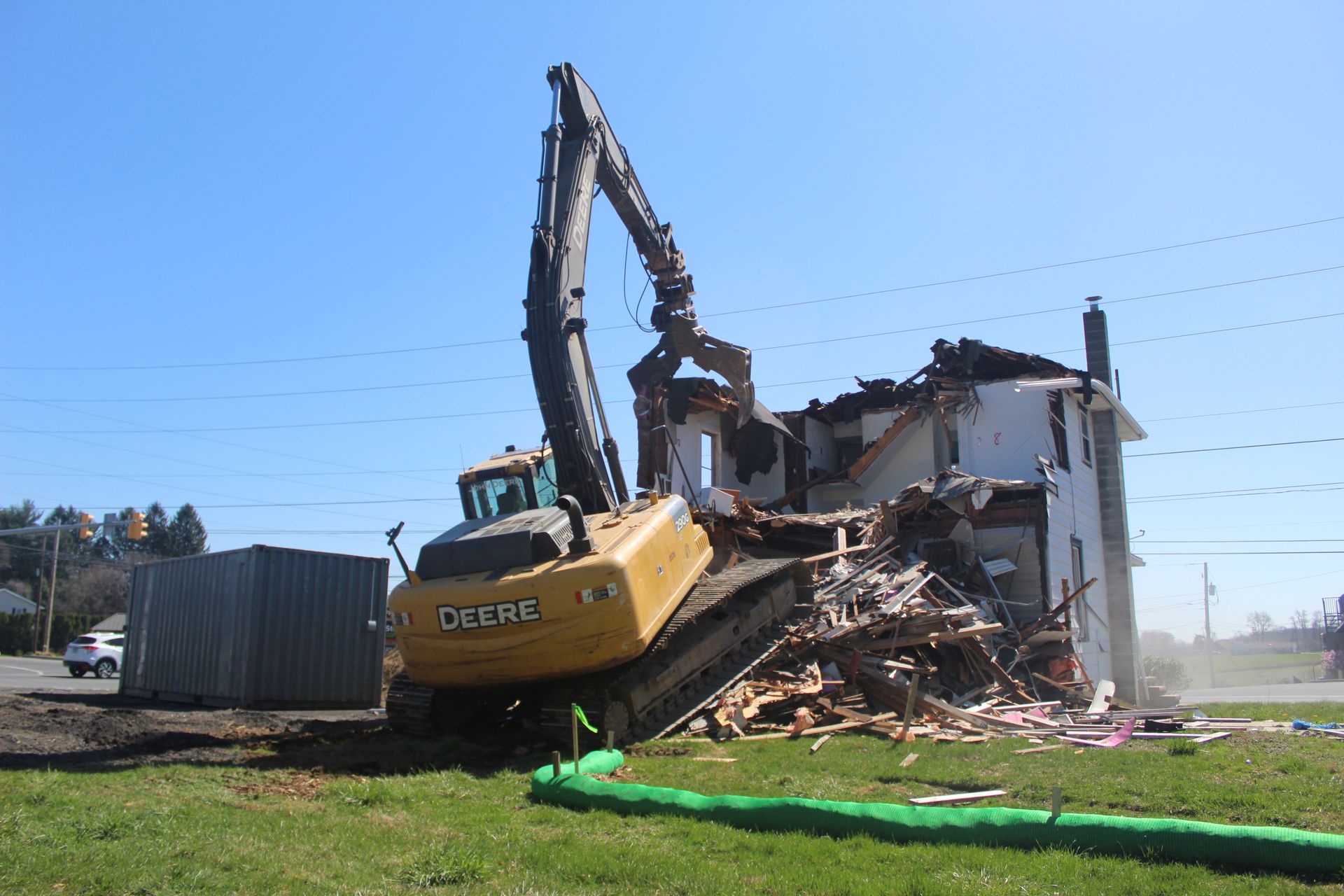 Demolition starting on the residential structure by the Empire Services crew.