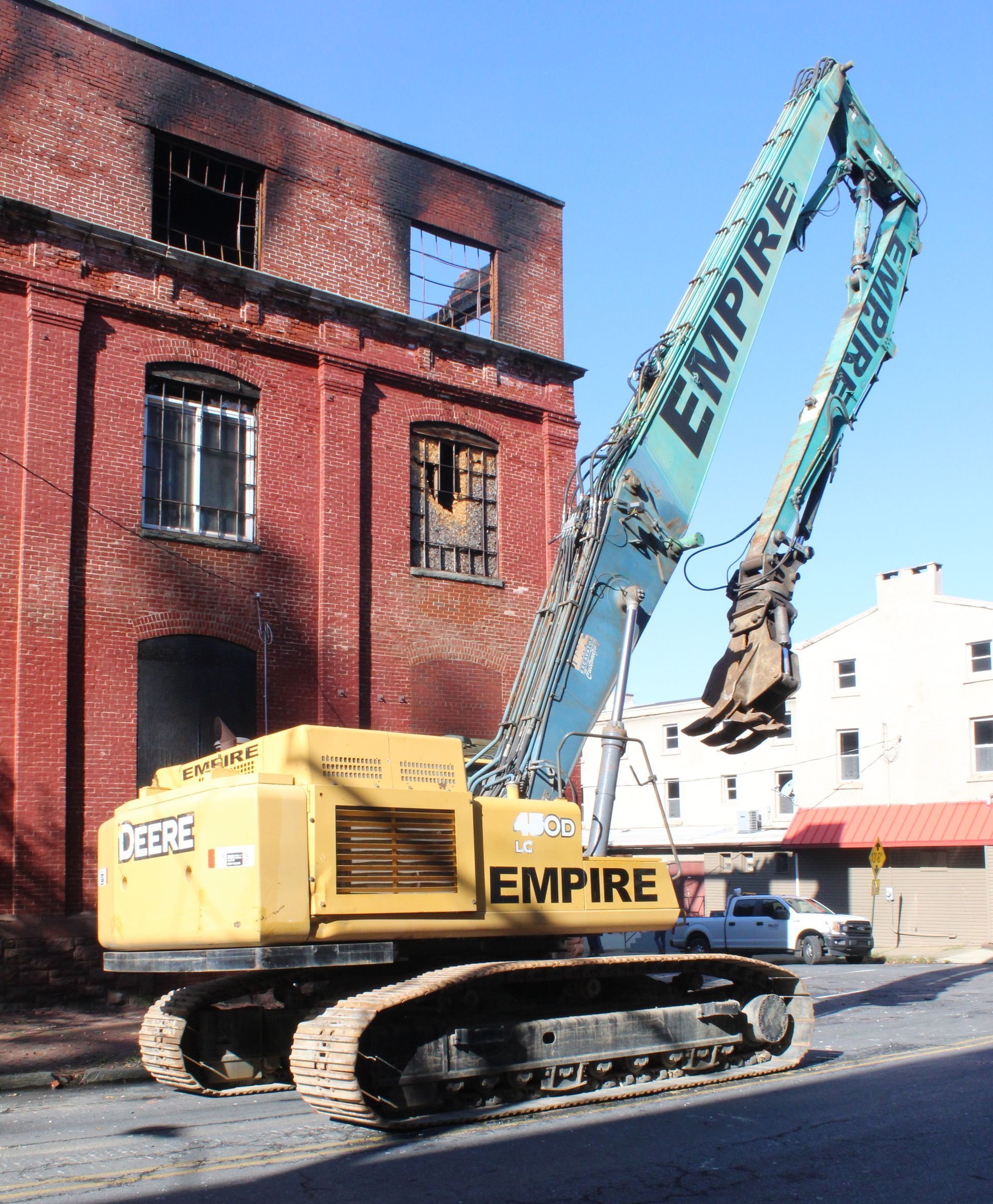 Empire Services uses a long reach excavator for the demolition.