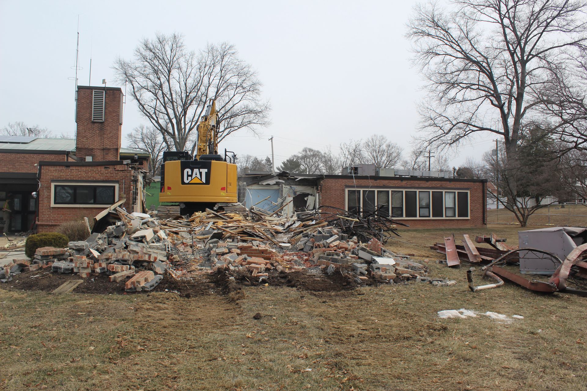 Empire Services' CAT 325 excavator gets to work on the structure. 