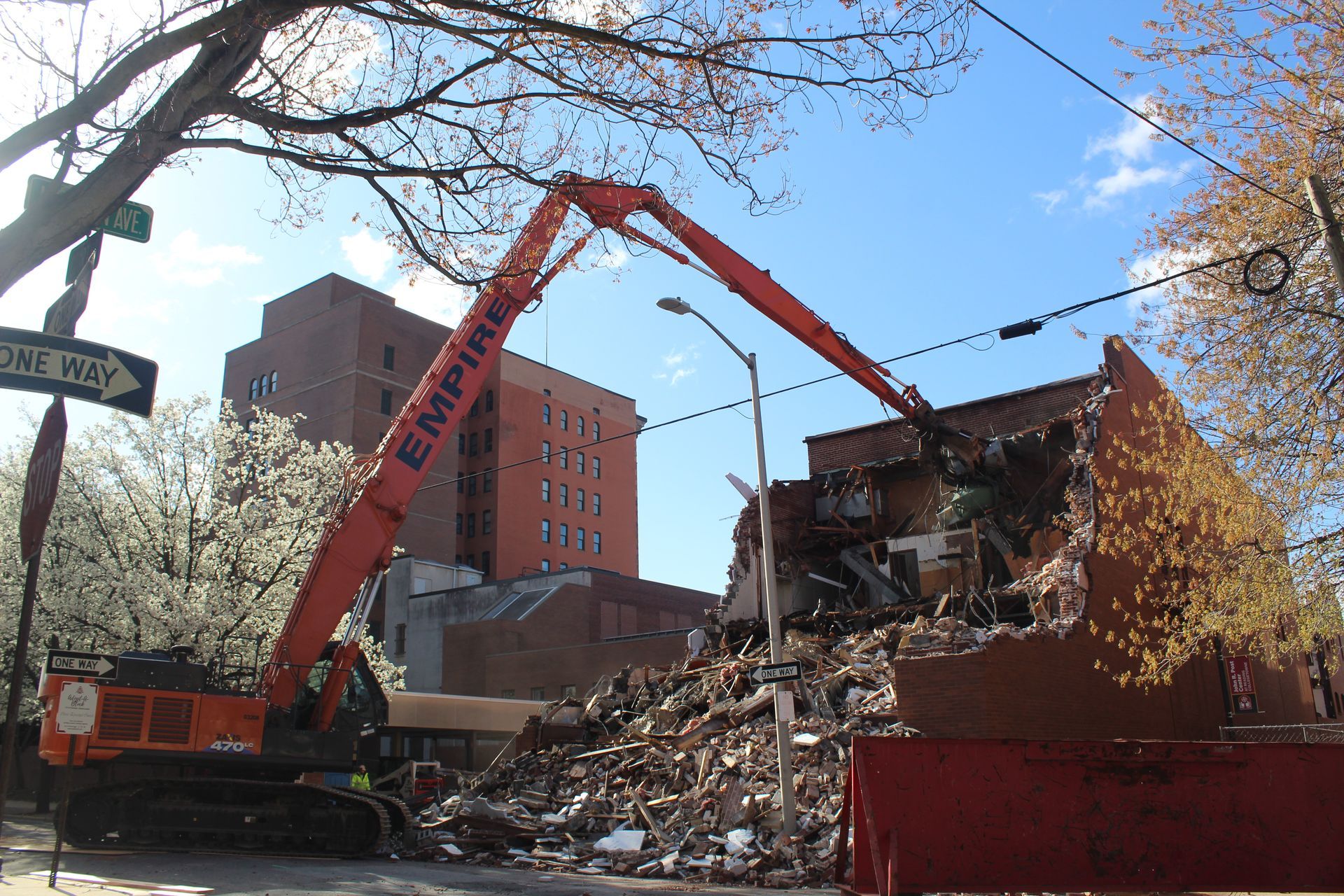 The excavator at the back of the building. 