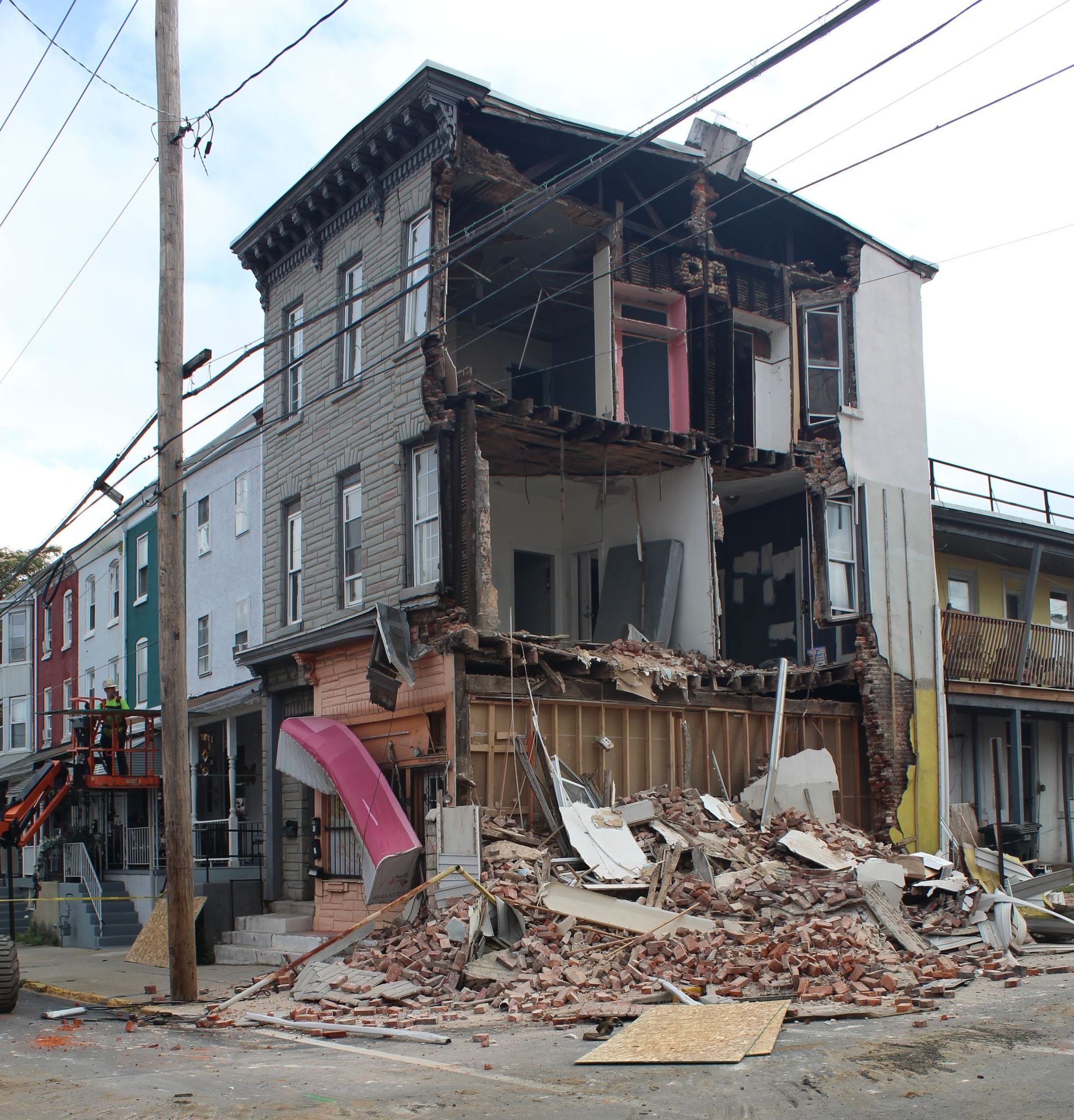 Emergency demolition of a collapsed wall. 