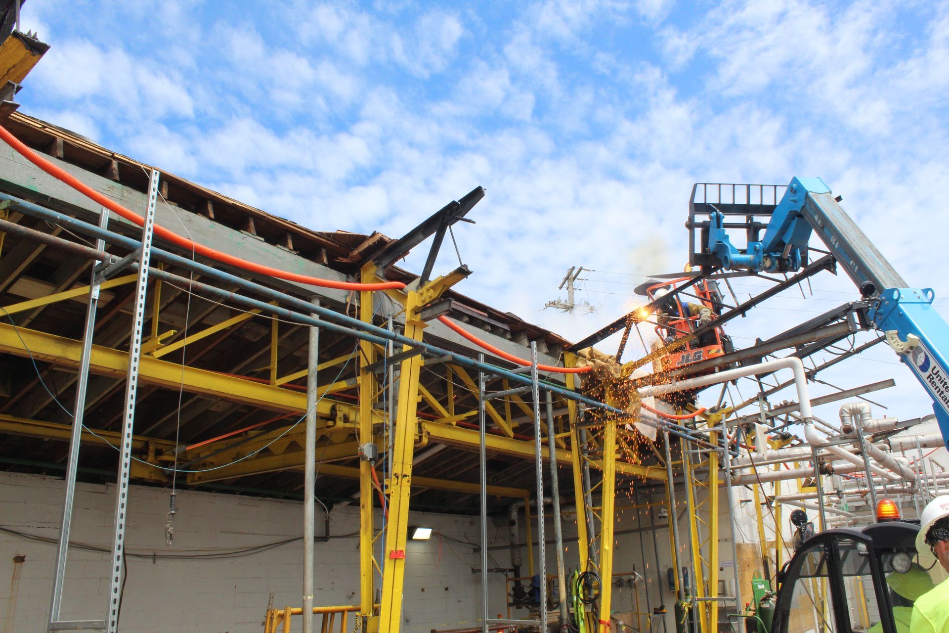Removing the support structures on one side of the building.