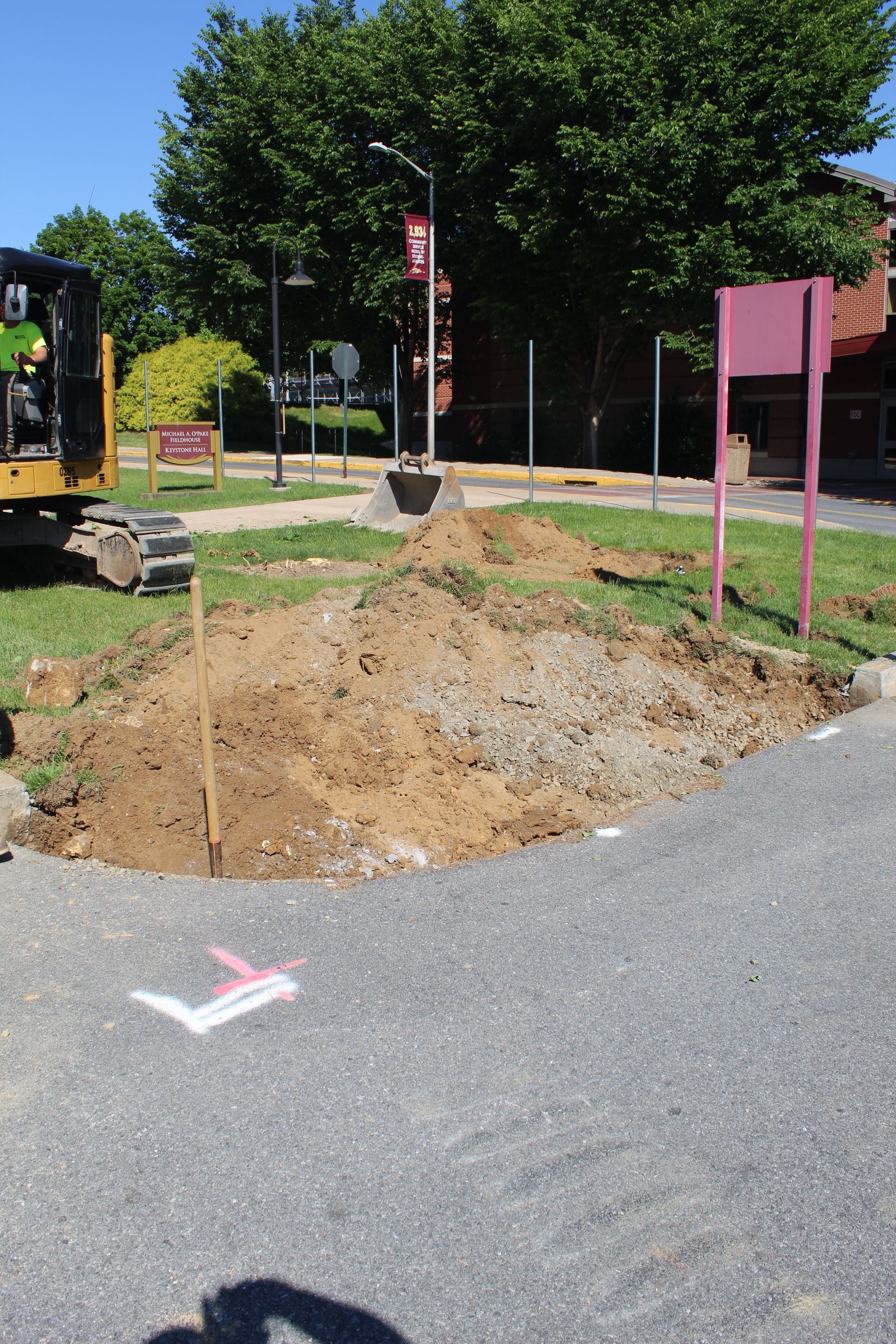 The curb and sidewalk are removed. Now the signage is removed.