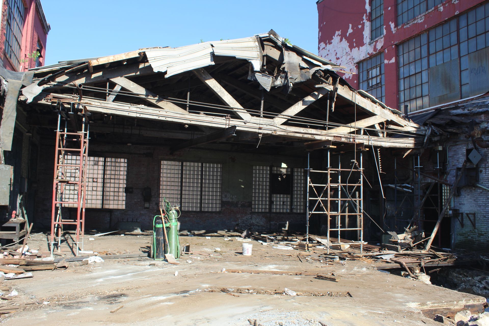 Empire Services demolishing wooden roof.