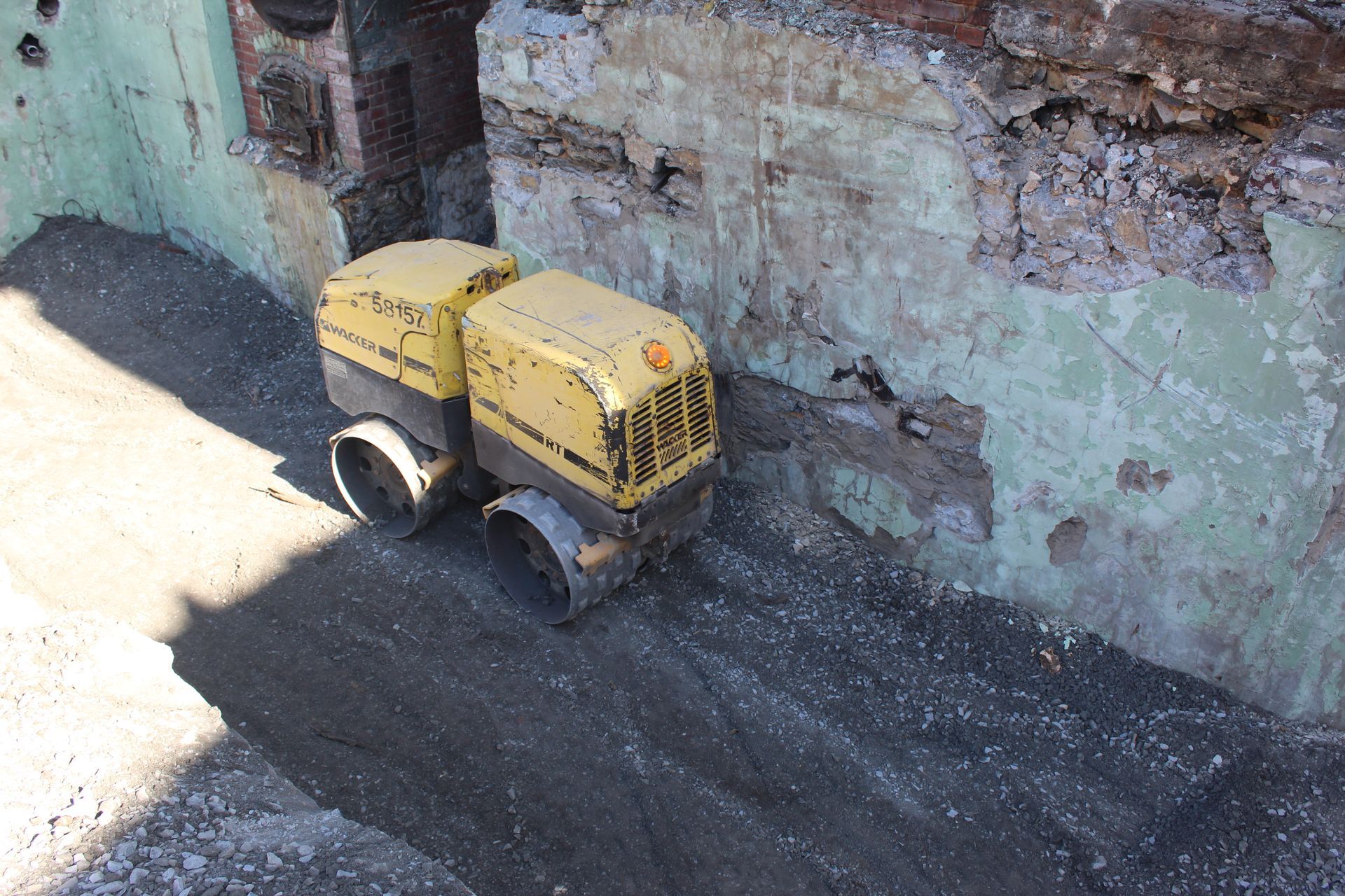 The RT-82 Wacker Neuson compacting the open work area.