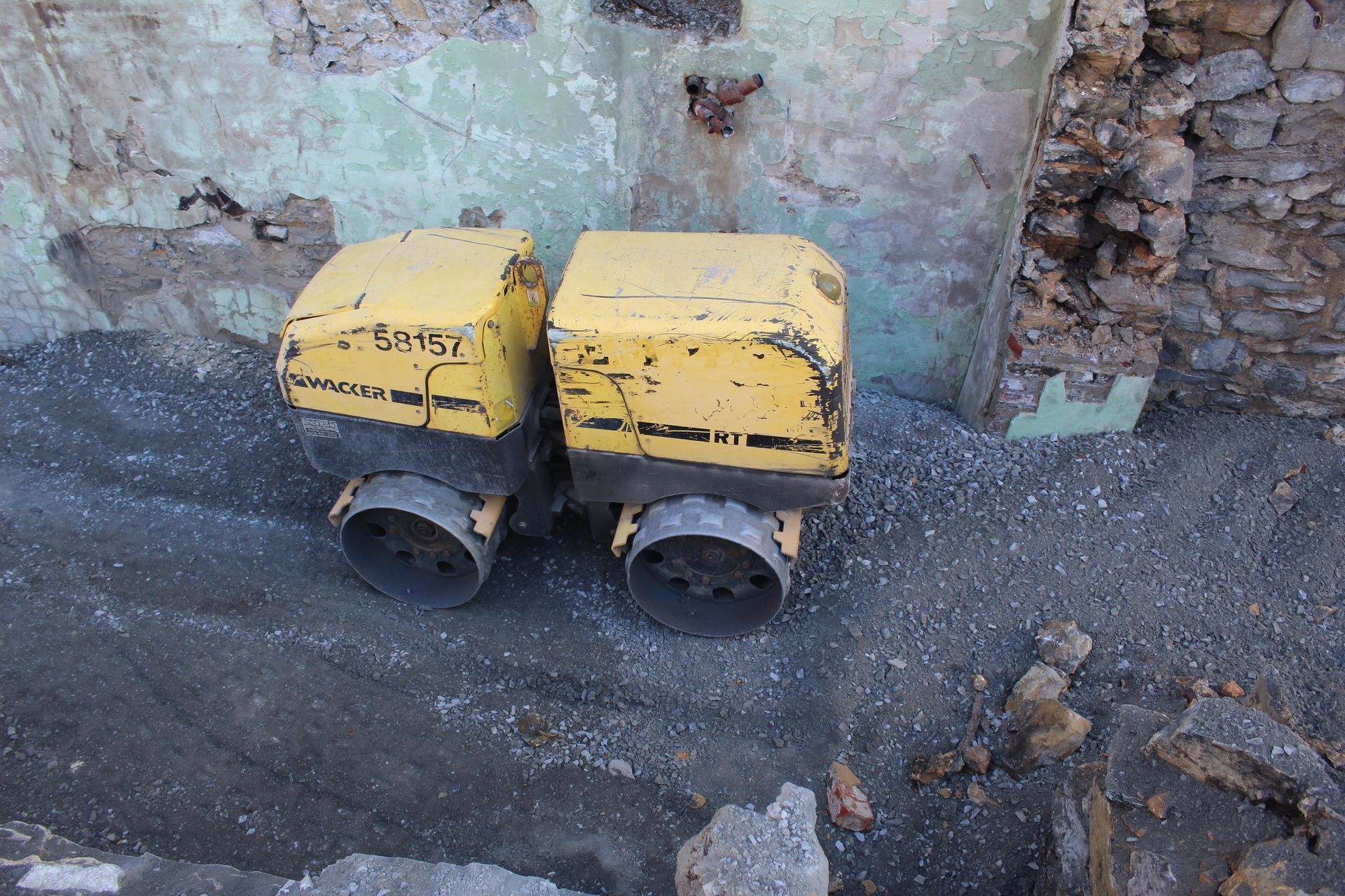 The RT-82 at work compacting the open work area to gain further access to the building.