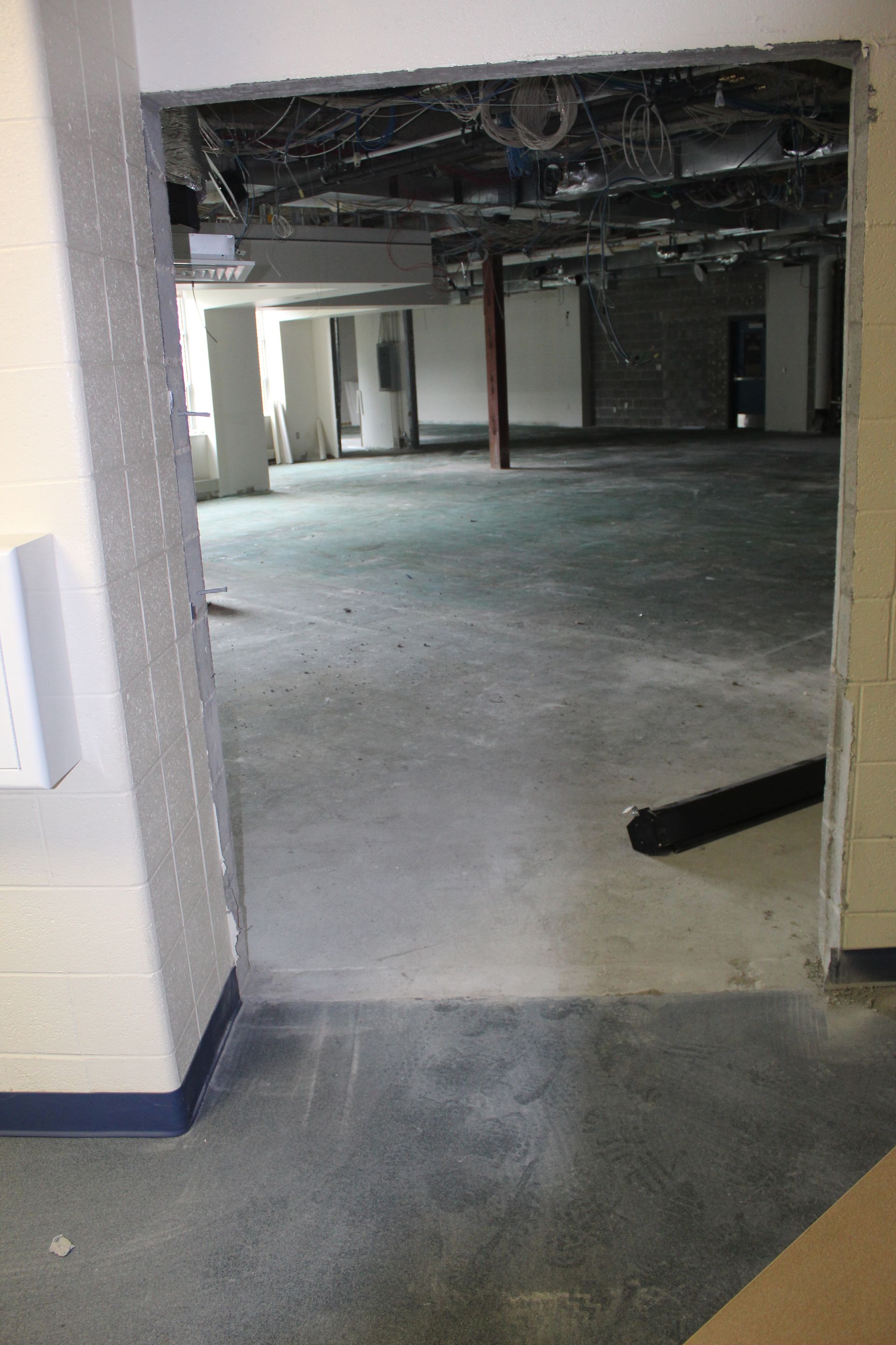 The interior components including carpeting are removed in this space.