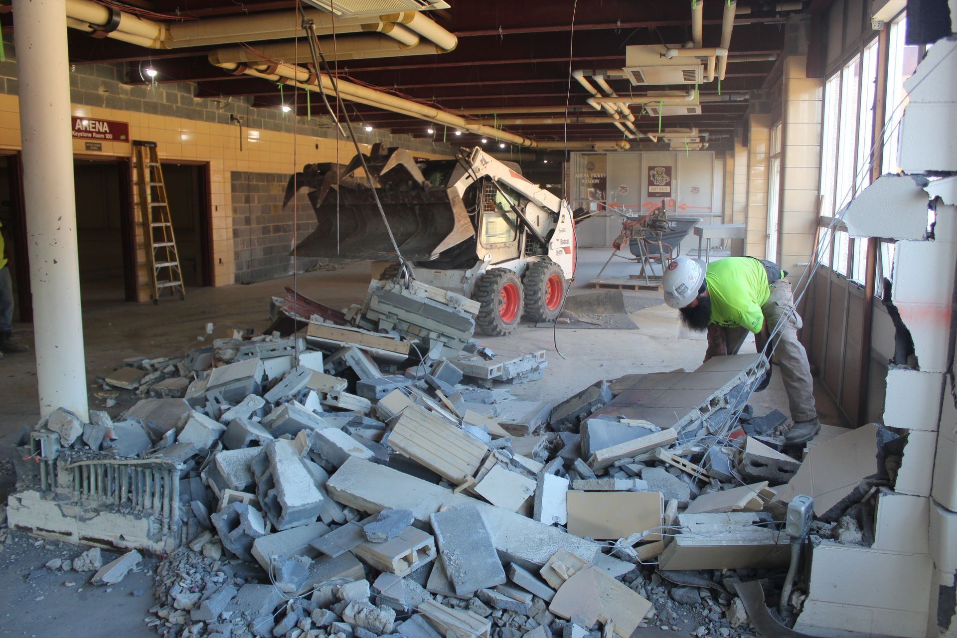 Empire Services team member helps to remove the debris.