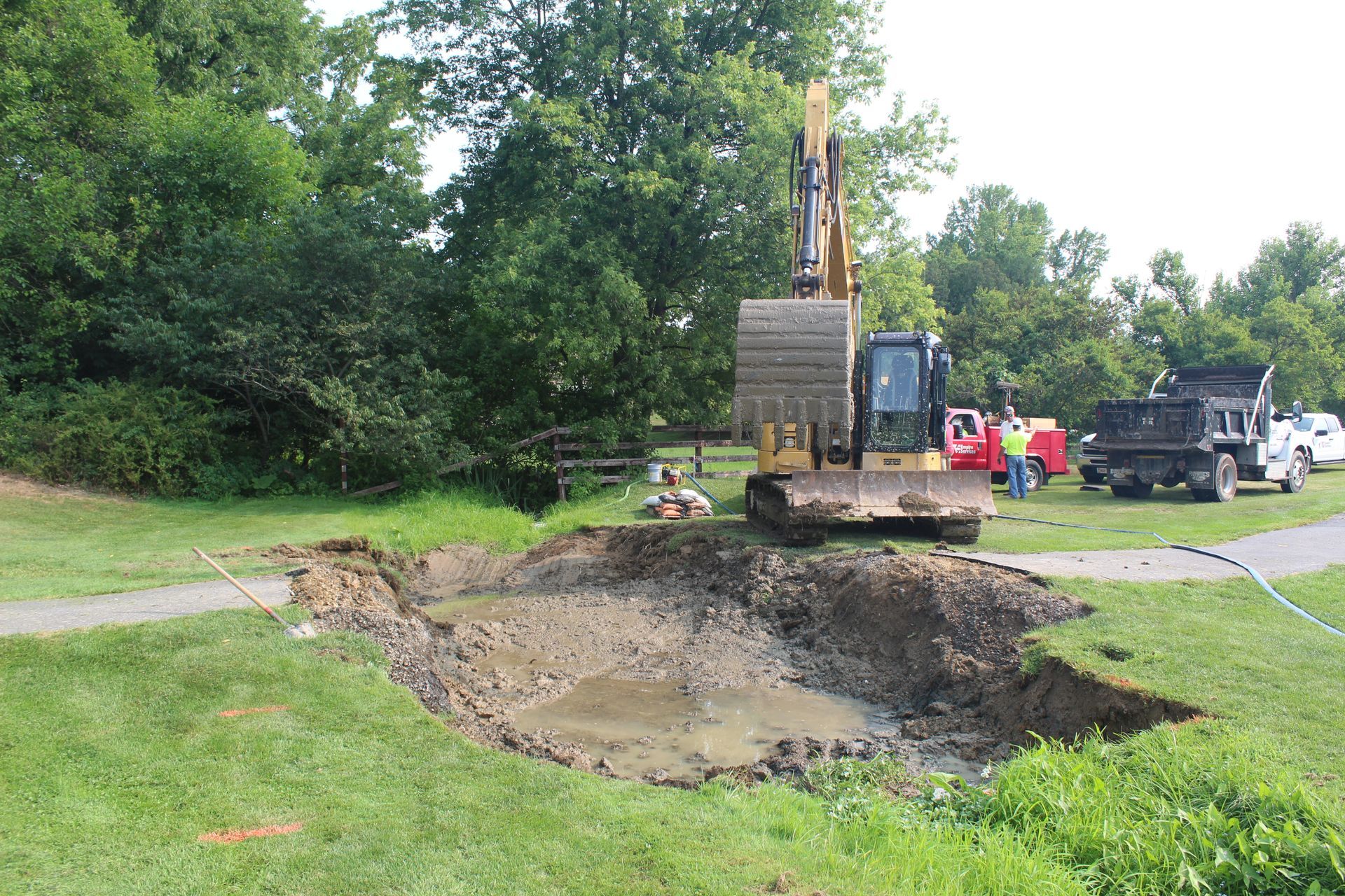 Empire Services installs the first of two culverts at a local golf course. 