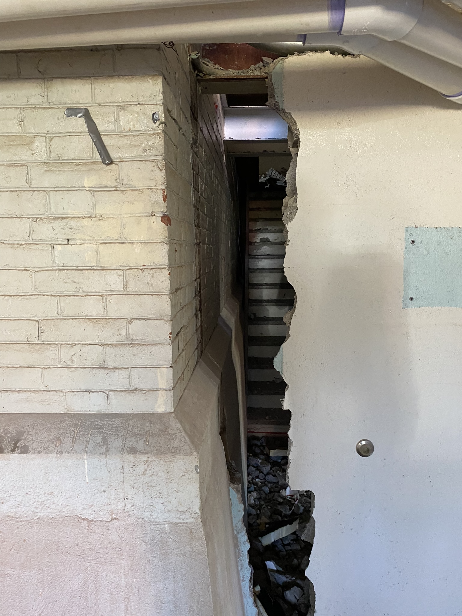 Hand separation of two buildings by Empire Services.