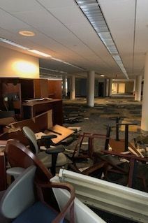 A room with a lot of chairs and tables in it
