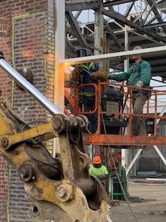 Empire Services crew torch cuts steel beams