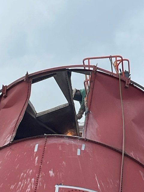 torch cutting the silo