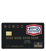 Black AAMCO credit card with gold chip, black background, and Financing Available text