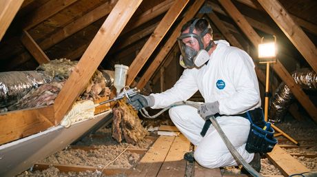 Male sealing an air pocket in an attic