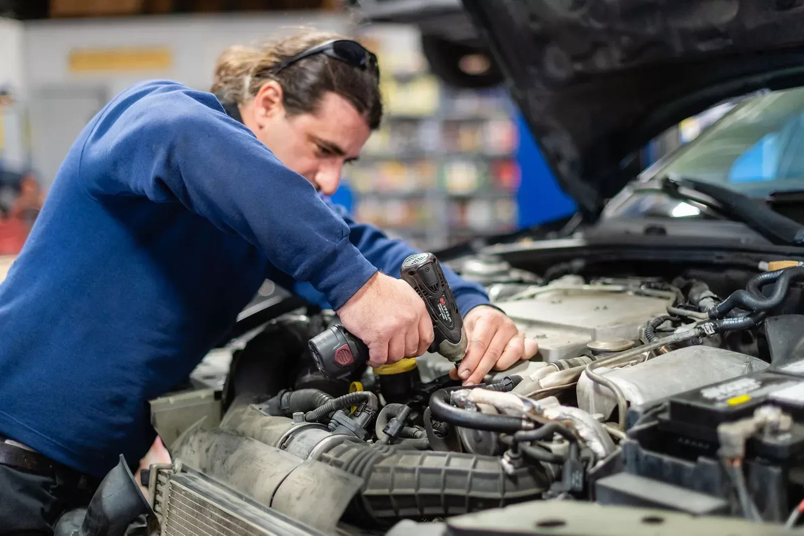 A mechanic repairing a vehicle | Texas Automotive Performance
