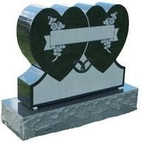 Heart-shaped black granite gravestone on a stone base with engraved floral design