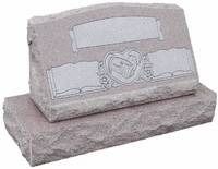 Gray granite grave marker with engraved scroll and heart on a rectangular base