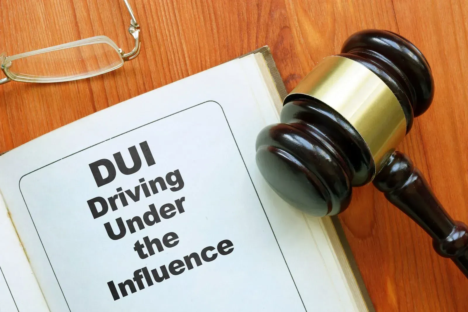 DUI booklet with a judge’s gavel on a wooden desk