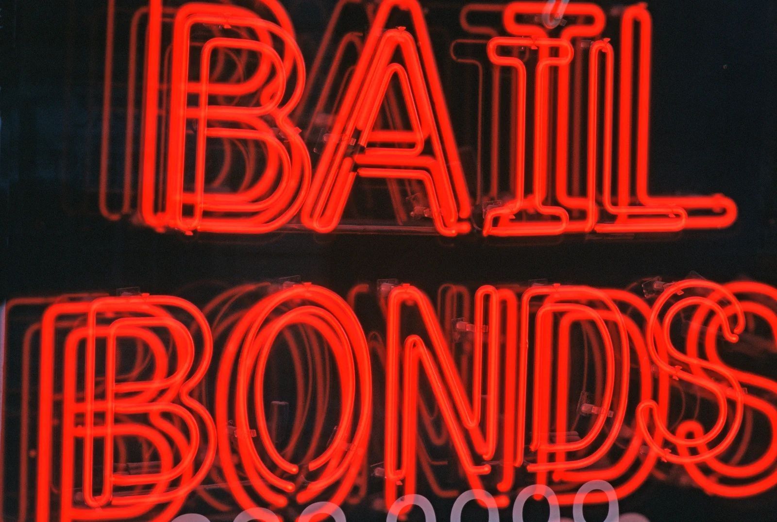 Red neon sign that reads 