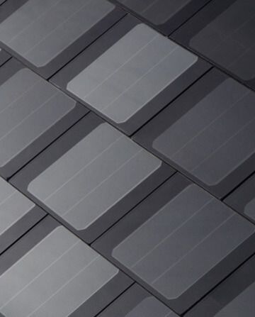 Abstract pattern of overlapping dark gray and light gray rectangular tiles