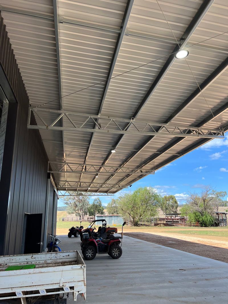 Outdoor Lights On The Shed With Motorcycle — Rohr Electrical in Dubbo, NSW