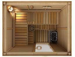 Wood-paneled sauna interior with benches, heater, fan, and white floor panel