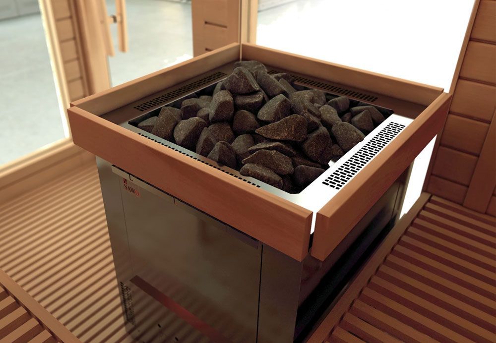 Indoor charcoal brazier filled with glowing coals beside a wooden floor