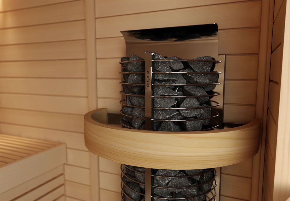 Indoor sauna heater with black stones and a wooden ring guard against wood-paneled walls