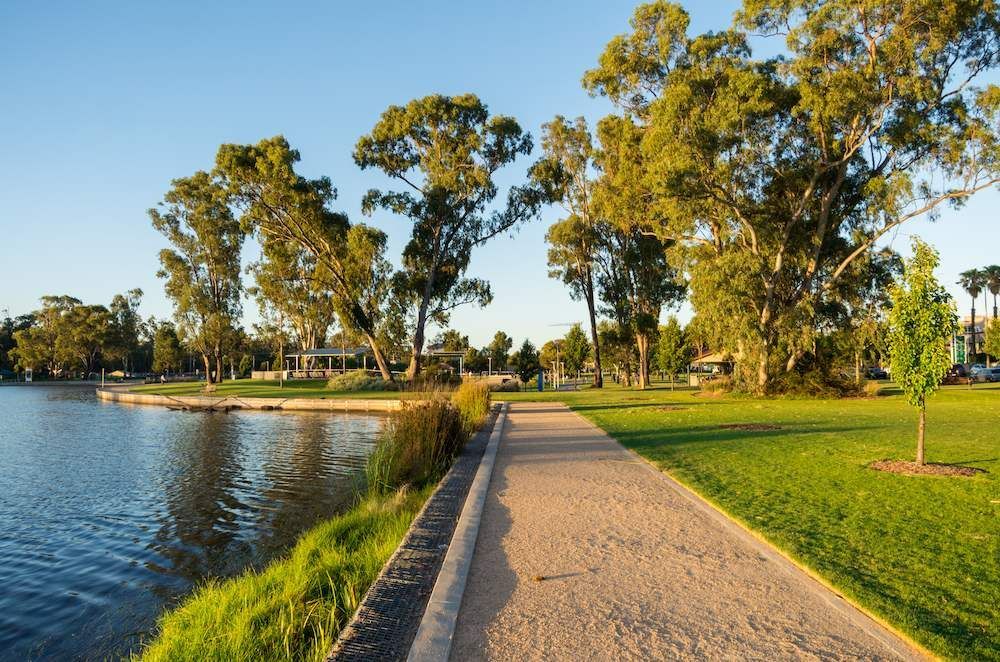 A Path Leading to a Lake Surrounded by Trees and Grass — Alexander Crane Tippers in Goulburn, NSW