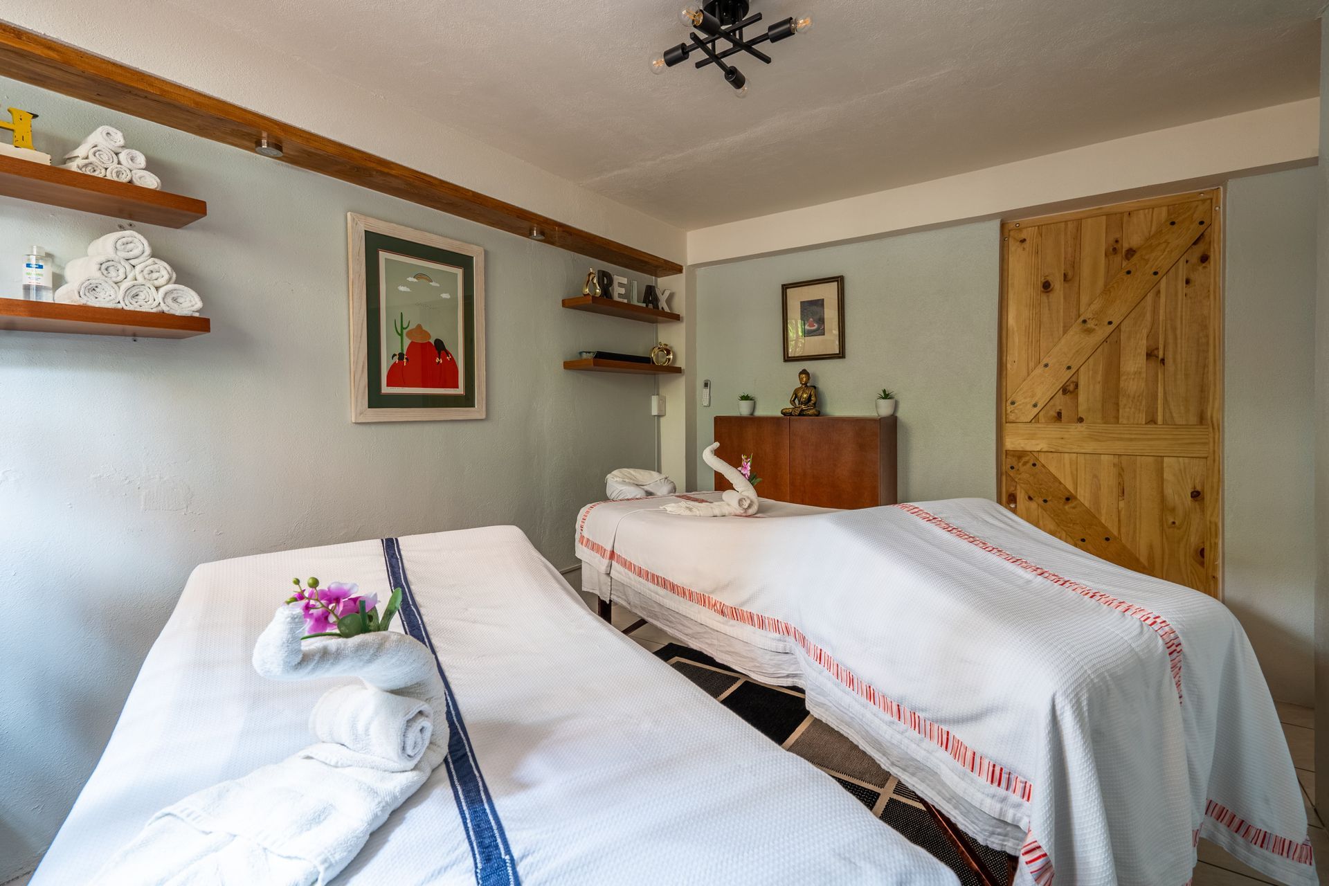 There are two massage tables in the room.