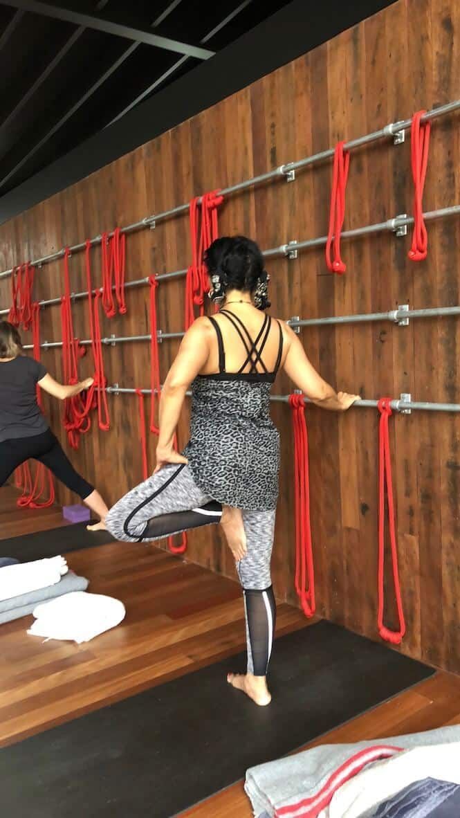 Female Pulling Up One Feet — Marrickville, Sydney — Black Lotus Yoga
