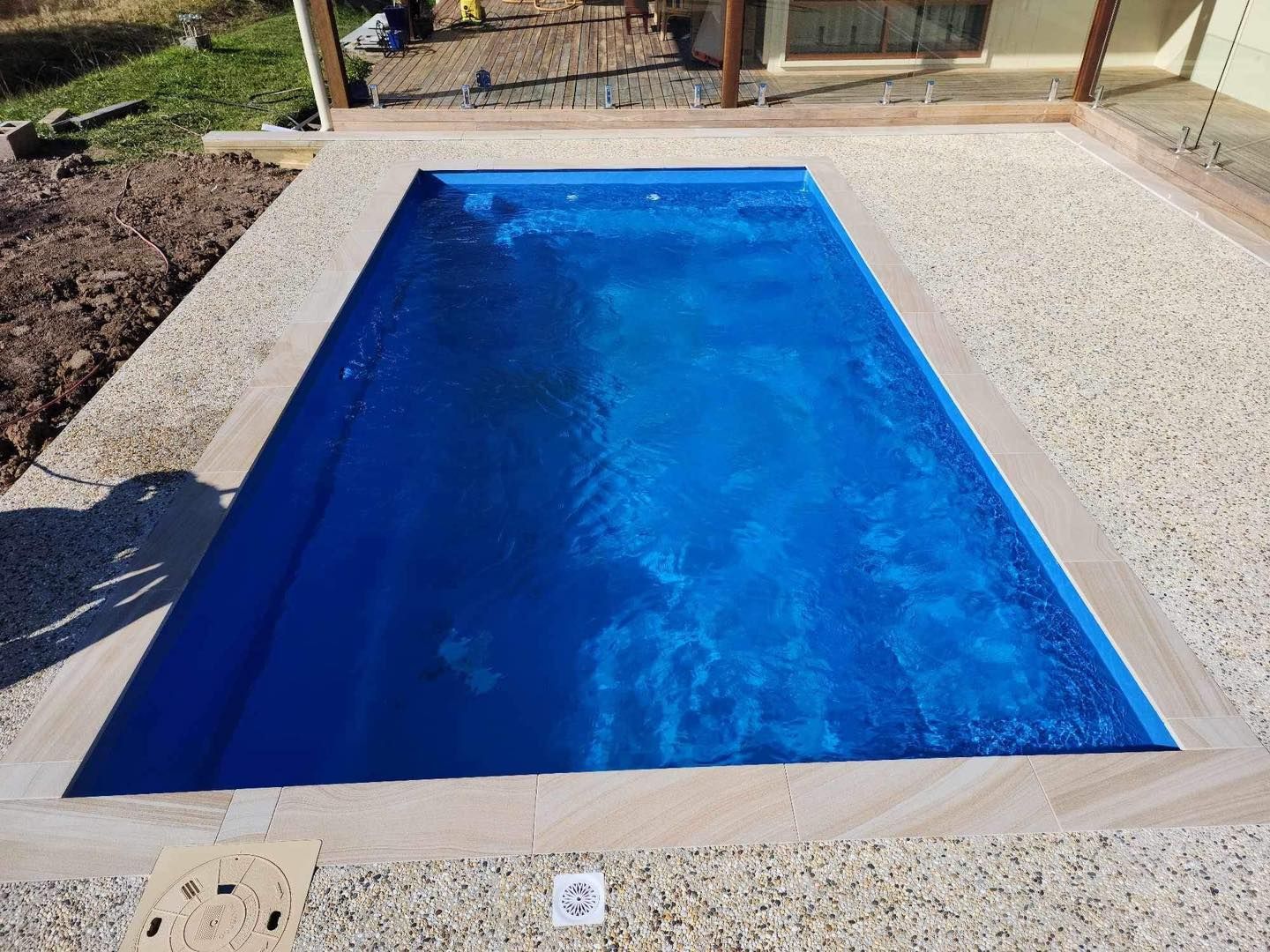 Blue Rectangular Swimming Pool, Surrounded — Clearwater Pools Hallidays Point in Bulahdelah, NSW