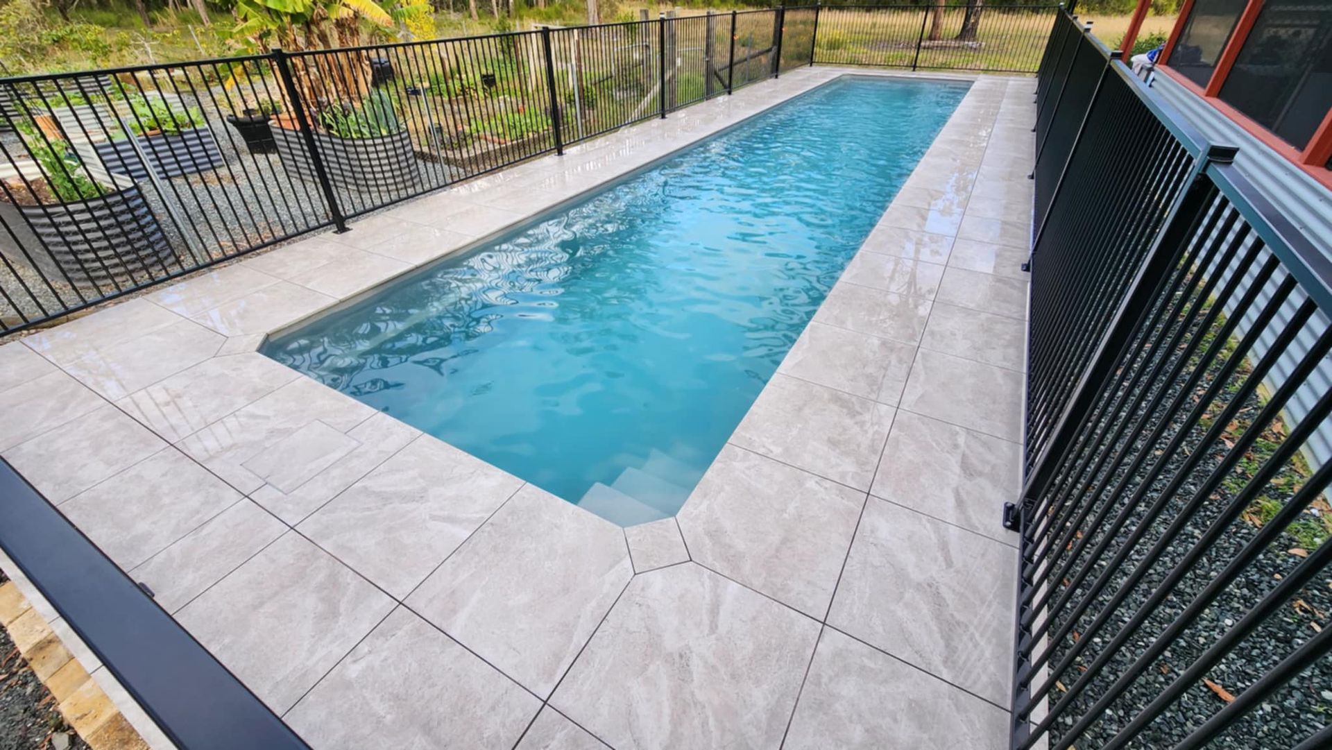 Rectangular Pool With Tile Surround, Fenced With Metal — Clearwater Pools Hallidays Point in Hallidays Point, NSW