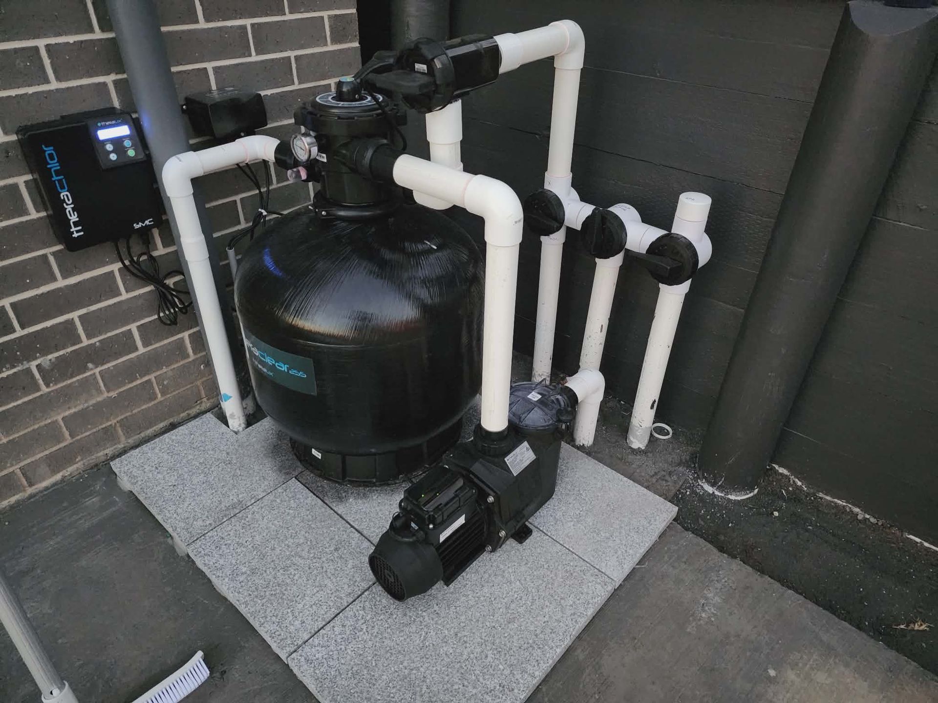 Pool Equipment: Filter, Pump, Pipes on Tile , Against a Brick Wall — Clearwater Pools Hallidays Point in Hallidays Point, NSW