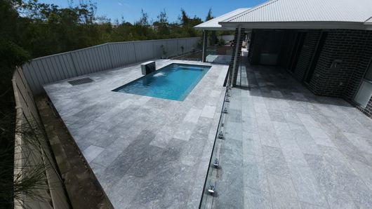 Brick Patio With Covered Walkway, Leading Towards a Pool — Clearwater Pools Hallidays Point in Hallidays Point, NSW