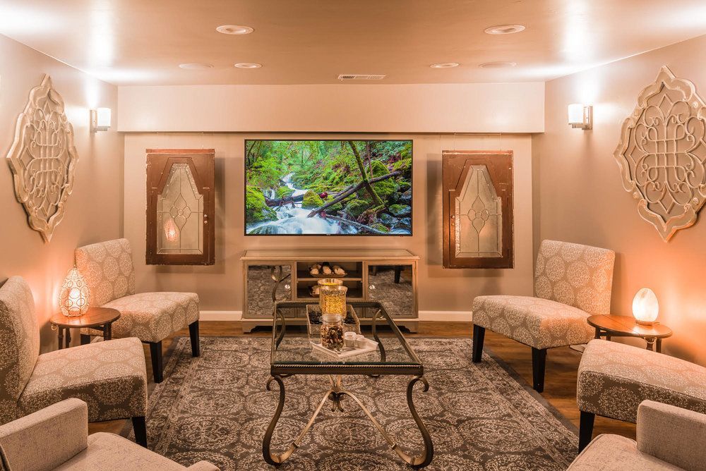A living room filled with furniture and a flat screen tv.
