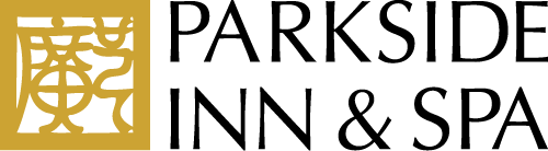 A logo for parkside inn and spa with a gold and black logo.