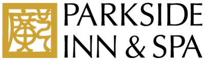 a logo for parkside inn and spa with a tree in the middle
