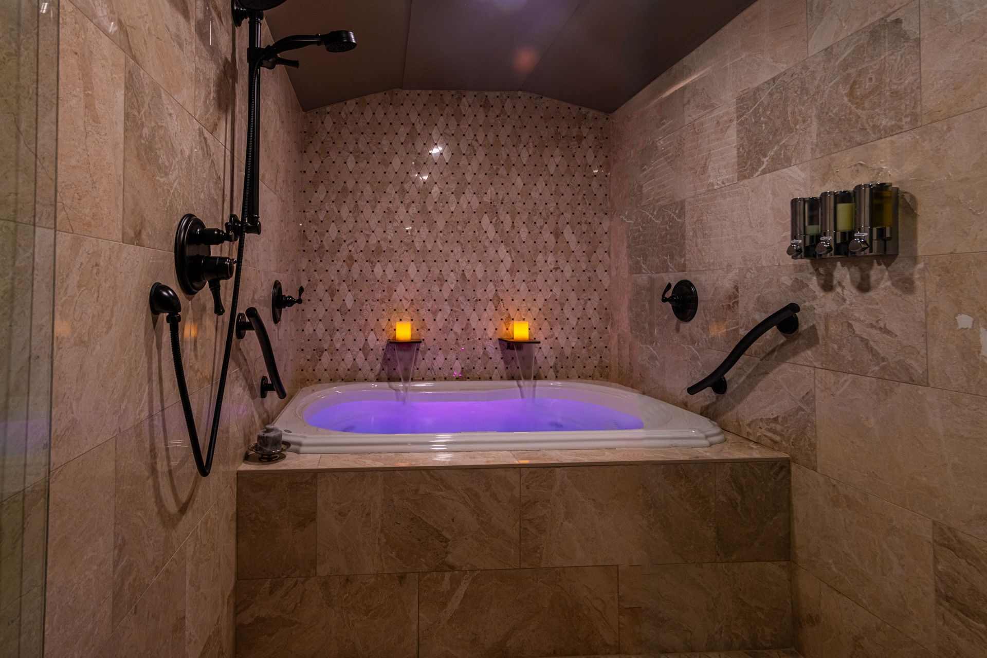 There is a large bathtub in the middle of the bathroom.