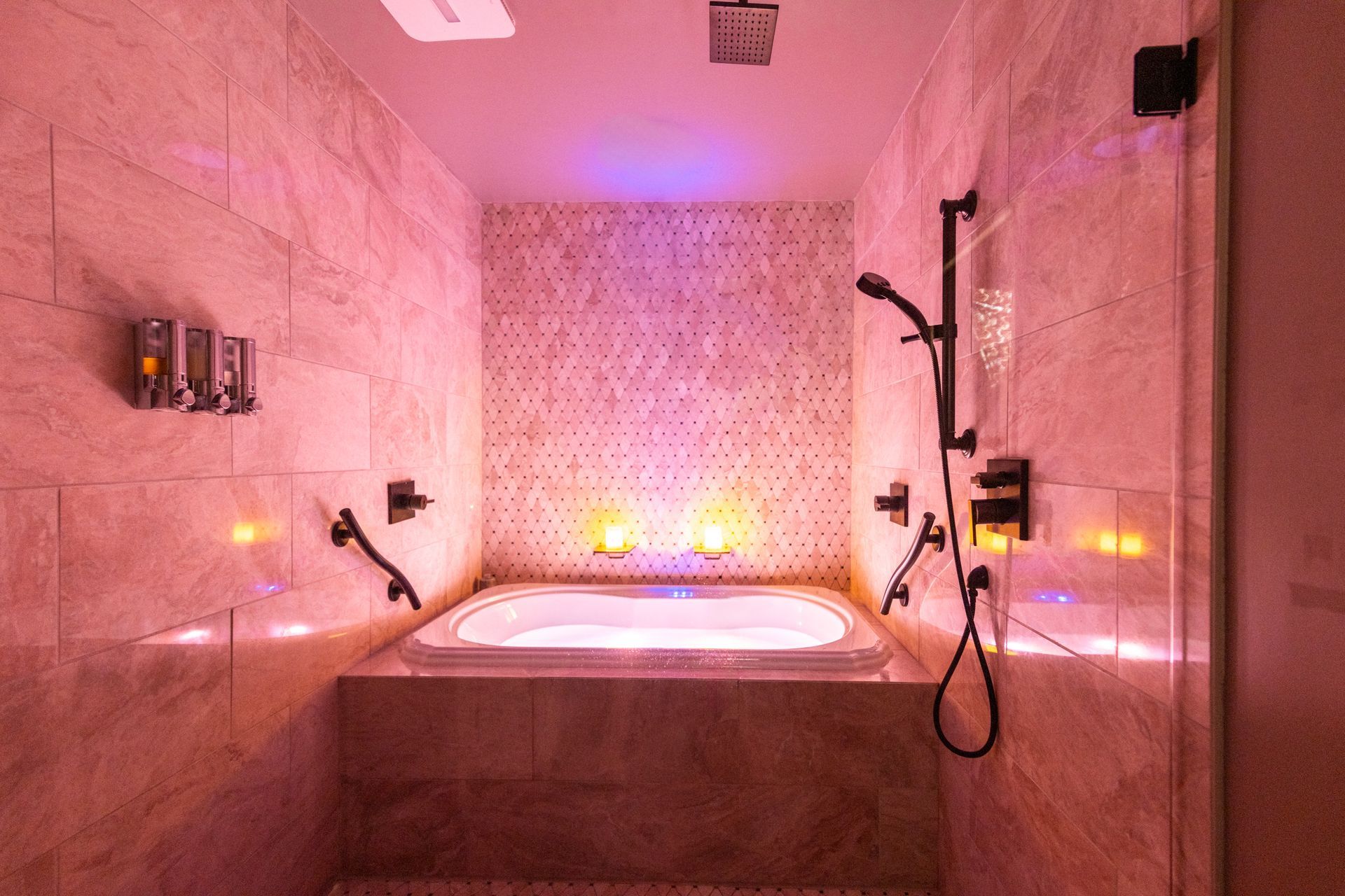 A bathroom with a jacuzzi tub and a shower.